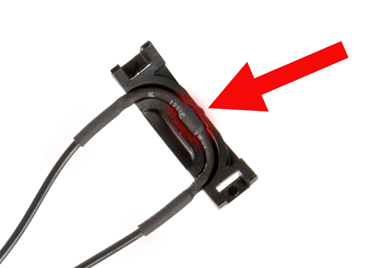 The thermistor presses against the motor