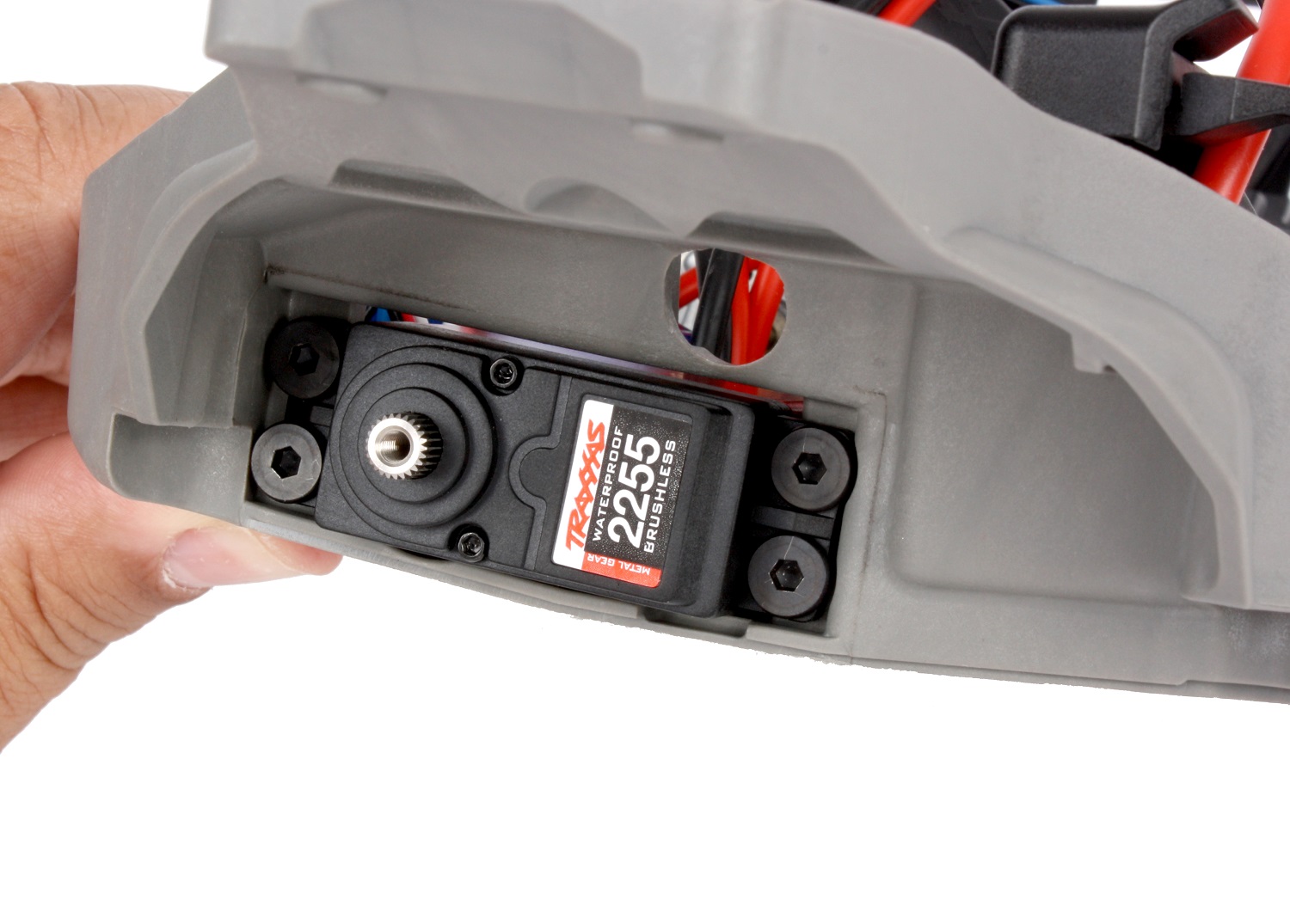 Remove the front suspension module to install the servo