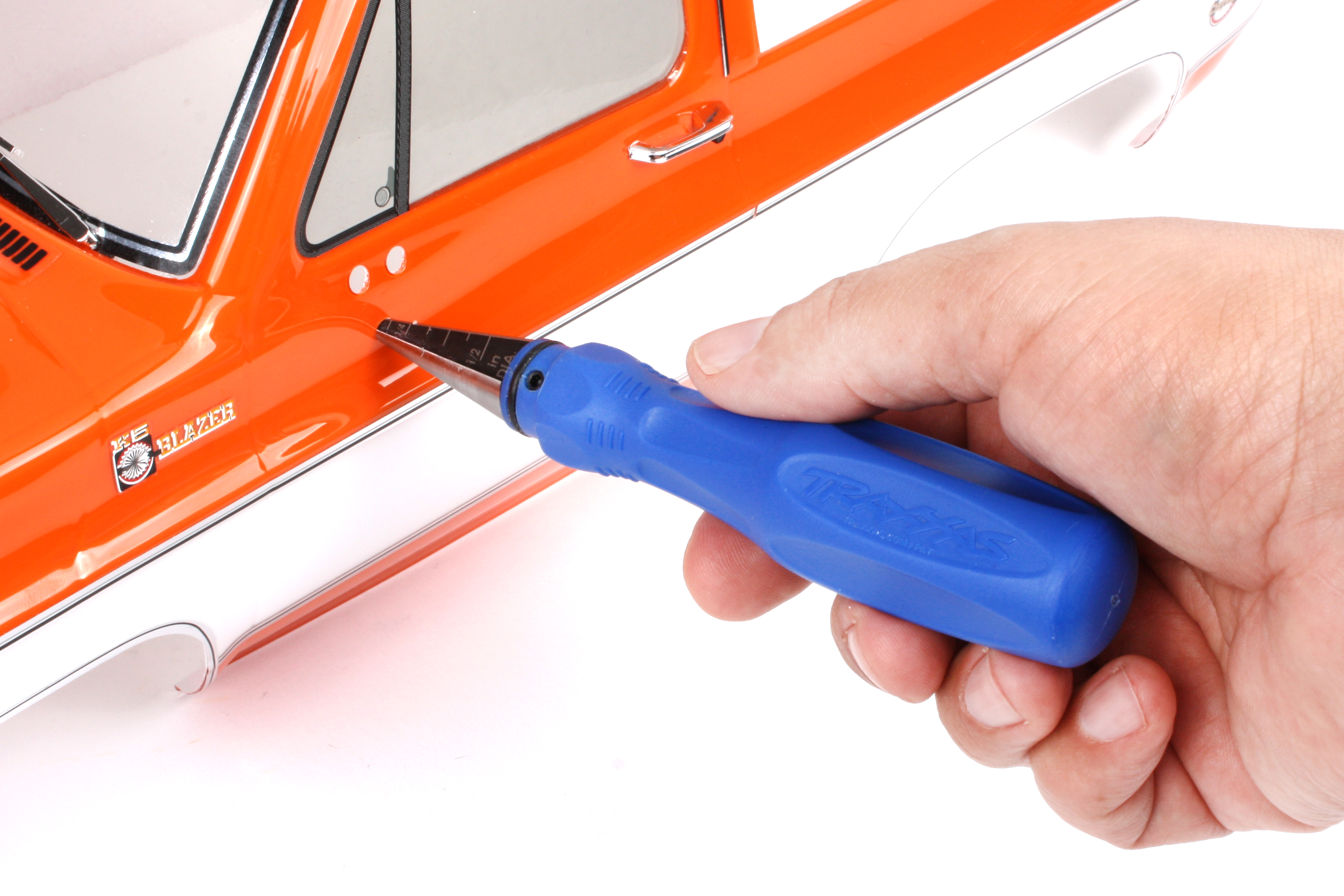Use a reamer to make new holes