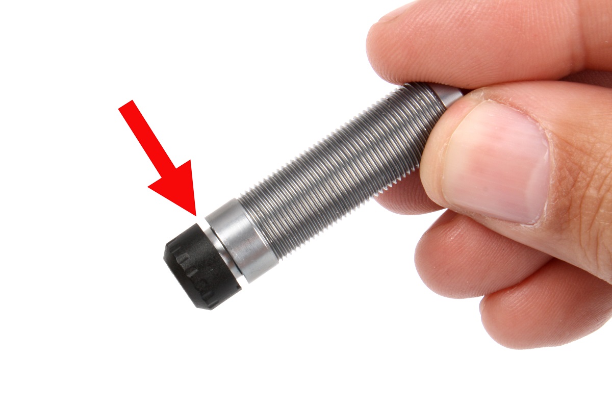 Leave the lower cap loose by one full turn