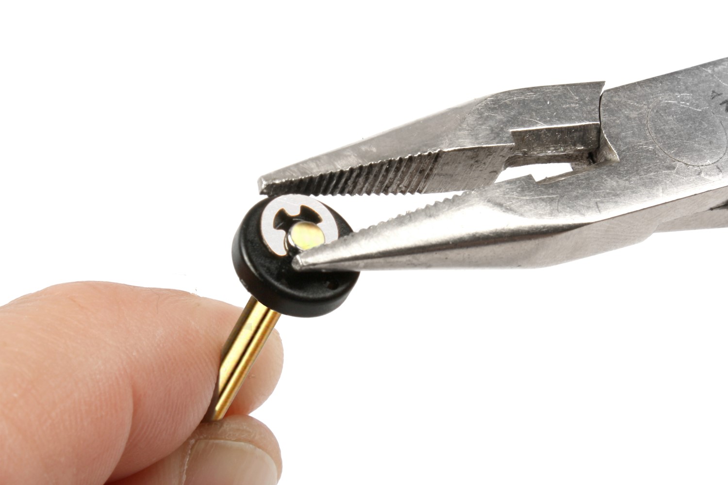 Use needle-nose pliers to secure the piston with a fresh e-clip.