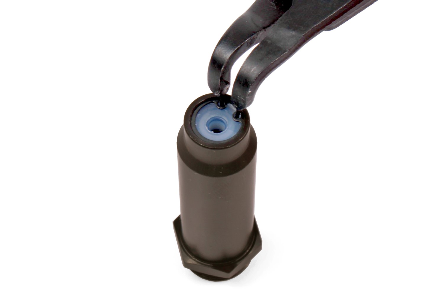 Install the new C-clip. To make the job easier, use a pencil eraser to press the washer down and fully seat the seal parts before installing the clip.