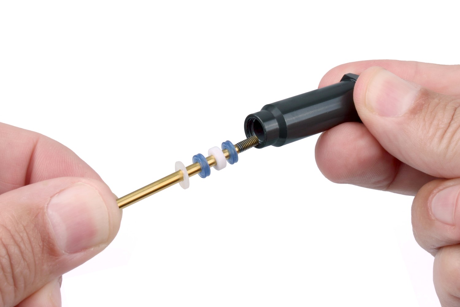 Use the shock shaft to extract the seals and spacers from the shock body.