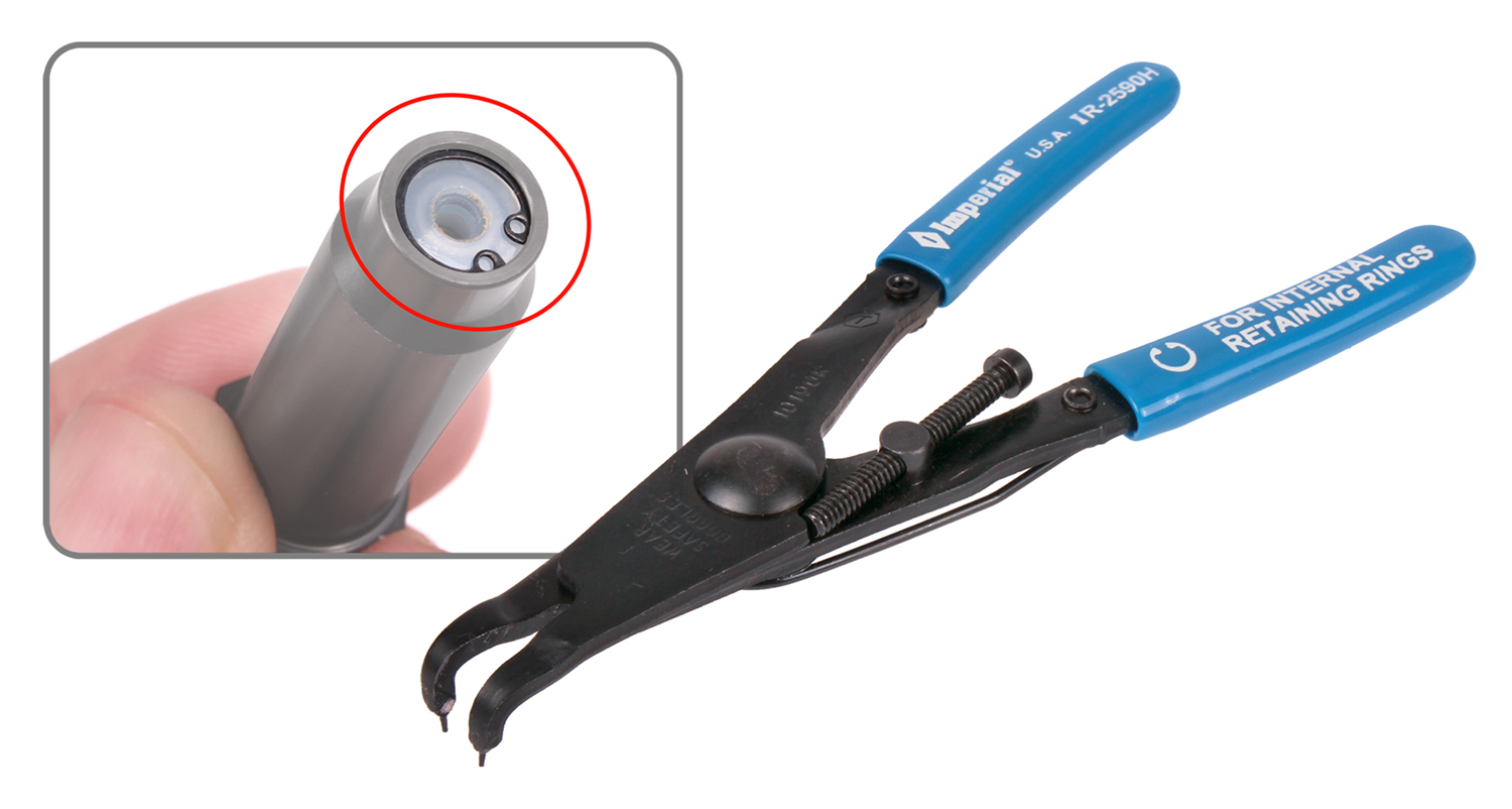 The C-clip are removed using specialized pliers.